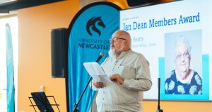 Glenn Beatty introducing the Jan Dean Members Award at the 2026 Newcastle Poetry Prize ceremony